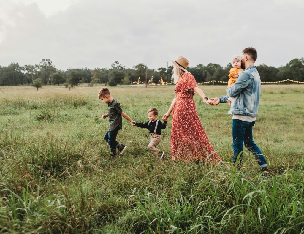 Family walking in meadow